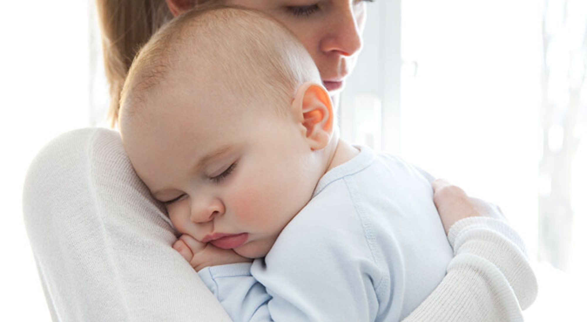Mother Holding Sleeping Baby